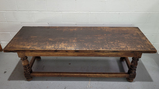 Hard to find longer then usual lovely rustic oak coffee table on turned legs. In good original detailed condition.