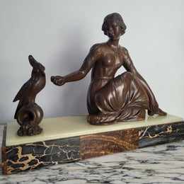 Art Deco bronze statue with brown patina of a lady and parrot on marble base. Signed by Italian Sculptor A Trefolini, an highly regarded sculptor, in very good condition.