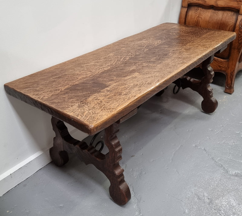 Charming French rustic Spanish style coffee table. It has an amazing rustic top and beautiful iron work. Sourced from France and is in good original detailed condition.