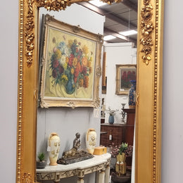 Stunning Vintage French floral gilt framed overmantel mirror. It has been sourced from France and is in good original detailed condition.