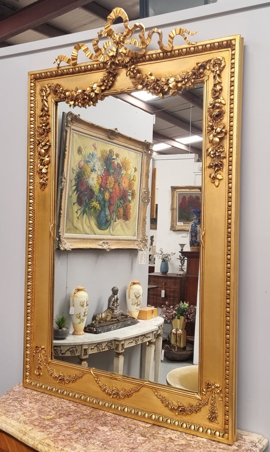 Stunning Vintage French floral gilt framed overmantel mirror. It has been sourced from France and is in good original detailed condition.