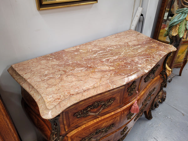 Beautiful French Louis XV style Kingwood inlaid marble top four drawer commode. It has decorative mounts and has been sourced from France. It is in good original detailed condition.