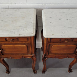 Pair of stunning Louis XV style French Walnut white marble top bedside cabinets. They have one drawer and a cupboard that is marble lined. The marble has been polished and they are in good original detailed condition.