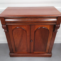 Cedar side cabinet with two doors one drawer and lovely door panels and corbels. It has been sourced locally and is in good original detailed condition.