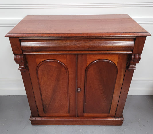 Cedar side cabinet with two doors one drawer and lovely door panels and corbels. It has been sourced locally and is in good original detailed condition.