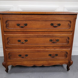 French Louis 15th style Oak three drawer chest of drawers with wooden top. It has been sourced from France and is in good original detailed condition.