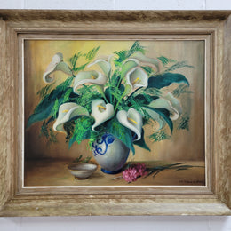 Signed and sourced in France a vintage oil on board still life of white lillie's in vase. In a beauitufl frame and it is in good original detailed condition.