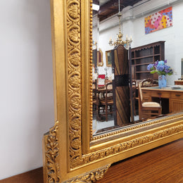 Stunning 19th Century French gilt mantle mirror. Bevelled mirror and amazing hand carved crest. It has been sourced from France and is in good original detailed condition.
