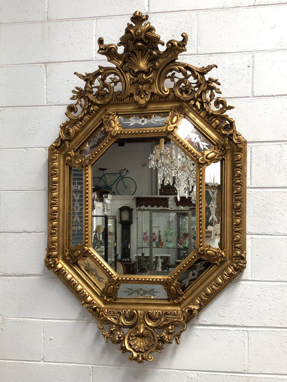 Early 19th Century gilt cushion mirror with acid etched floral pattern. In good condition. Please note original mirror does show some spotting commensurate with its age. Circa