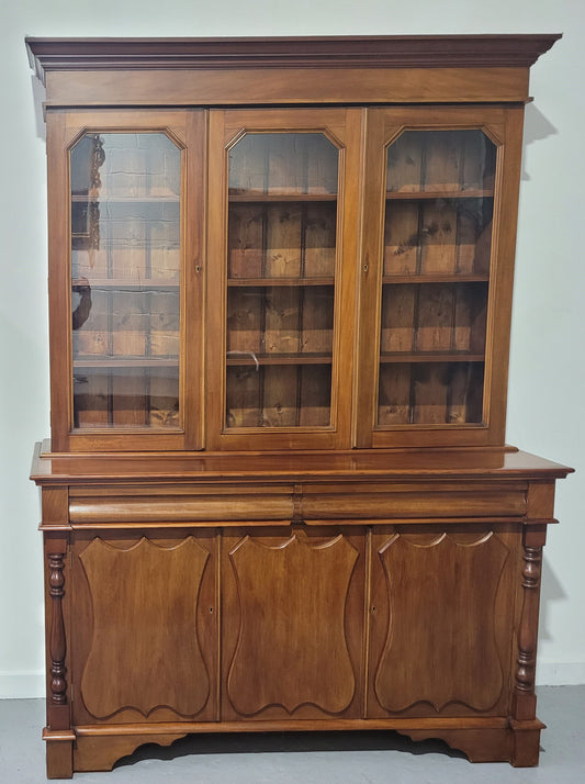 Edwardian mahogany bookcase with three glass display doors and three shield cupboards below. Amazing storage with two drawers. four shelves at the top and two shelves at the bottom. Please Note: middle glass door and middle shield door do not open but both are removable. In good original detailed condition.