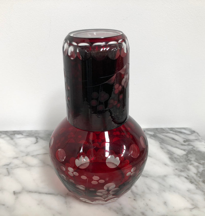 Vintage flash ruby glass water carafe with matching drinking glass.