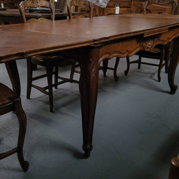 French Oak Louis XV style parquetry top extension table. It can sit six people when not extended and eight when fully extended. It has been sourced from France and is in original detailed condition.