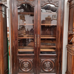 Substantial French Henry 2nd Walnut two door bookcase. It has five fully adjustable shelves and has been sourced from France. It is in good original detailed condition.