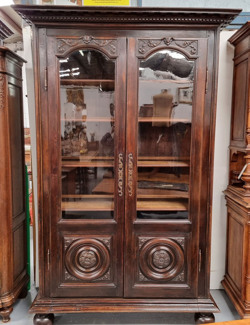 Substantial French Henry 2nd Walnut two door bookcase. It has five fully adjustable shelves and has been sourced from France. It is in good original detailed condition.