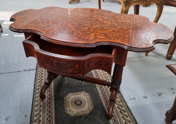 Fabulous marquetry inlaid side table with marquetry extensions and one drawer. Stunning side table or small ladies desk.