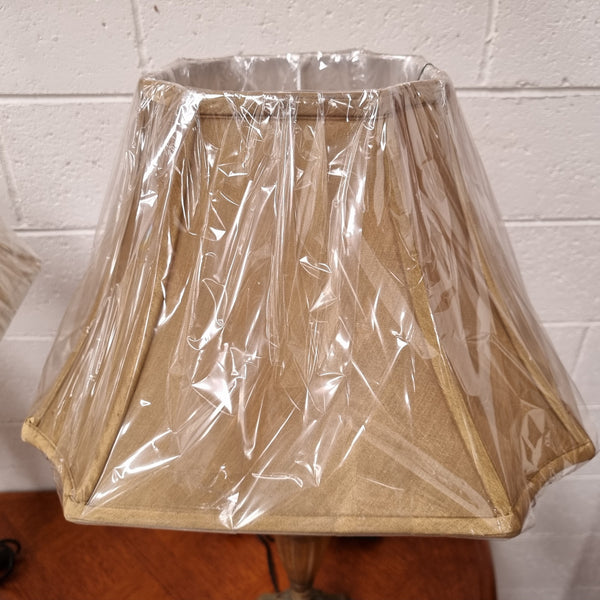 Beautiful pair of metal and glass lamp bases with new gold shades. They are in good original working condition and have been sourced locally.