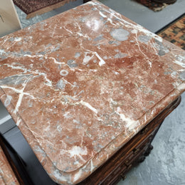 A pair of hard to find French Oak Louis XV style four drawer marble topped bedsides with attractive carvings. They are in good original detailed condition and have been sourced from France.