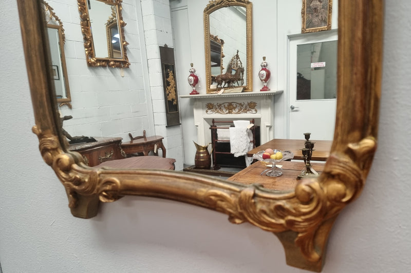 Stunning 19th Century French hand-painted wall mirror. The beautiful painted top panel of a couple in a lovely gold painted frame, in good original detailed condition.