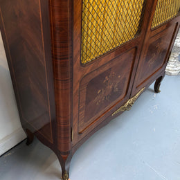Beautiful 19th Century French Louis XV style Mahogany Blind Bookcase. This piece has lovely inlaid doors and ormolu mounts, marble top and four adjustable shelves. In good original detailed condition.