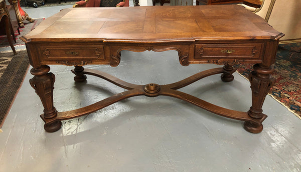Beautifully carved 19th century French oak Bureau Plat. With a lovely parquetry top and two drawers and decorative carved legs this piece is definitely one to look at . In good original detailed condition.