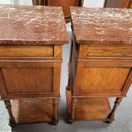 Pair French Oak Henry II style rouge marble topped bedside cabinets. Consisting of one drawer, one cupboard and a bottom shelf. Carved decoration and turned legs. Circa: 1900's.