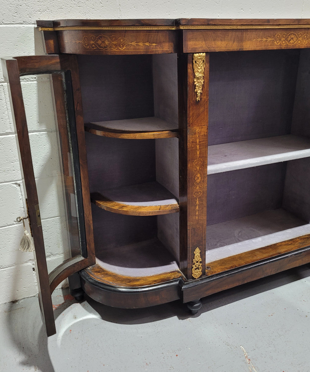 Victorian Rosewood inlaid side cabinet/credenza with velvet lined shelves and gilt mounts. It has been sourced locally and is in good original condition with loads of character.