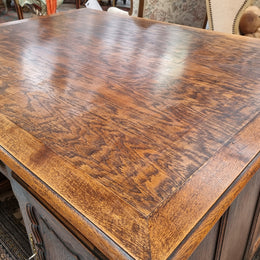 Fabulous Louis XV style French Oak beautifully carved full partners desk. Both sides have a functioning drawer in the middle and two cupboards either side. On both sides one cupboard door opens up to four smaller internal drawers. Plenty of storage space and a large top surface to work on. It is in good original detailed condition.