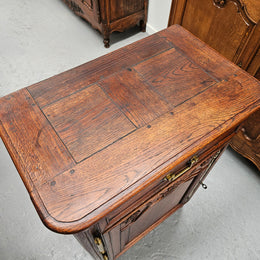 Louis 15th style oak 19th century cabinet with lovely brass hinges, handles & charming carving.  Circ: 1860's. In good original condition.