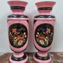 Late Victorian pink and hand painted, enameled pair of vases with some ware to enameling. It is in good original condition.