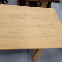 French raw Oak stretcher based refectory table. Features raw wood that could be used as is for a distressed look, or finished and waxed for a more refined look. Sourced from France and in good original condition.