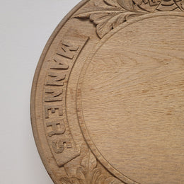 Antique circular Oak bread board carved with “Manners Makyth Man” and the arms of Winchester College England. It is in good original condition, please view photos as they help form part of the description.
