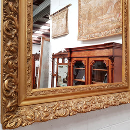 Large French Antique 19th century ornate gilt framed mirror. Circa 1880 and it is in very good original condition.