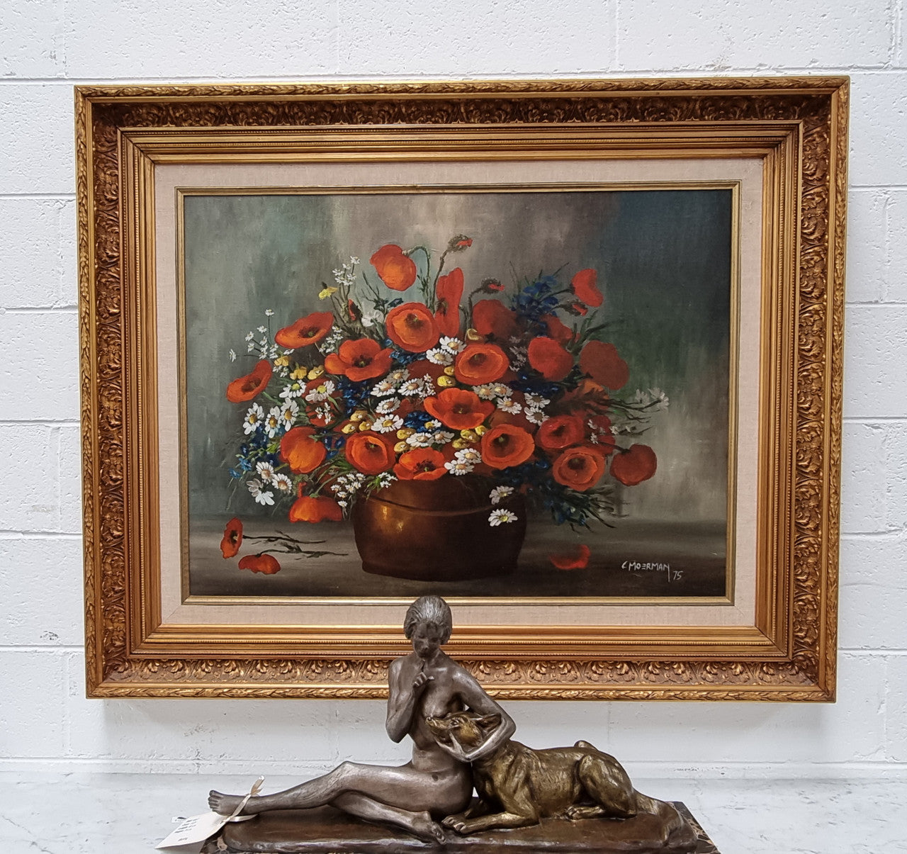 Lovely Vintage signed floral oil on canvas of Poppies and Daisy's and in a decorative gilt frame . In good original detailed condition.