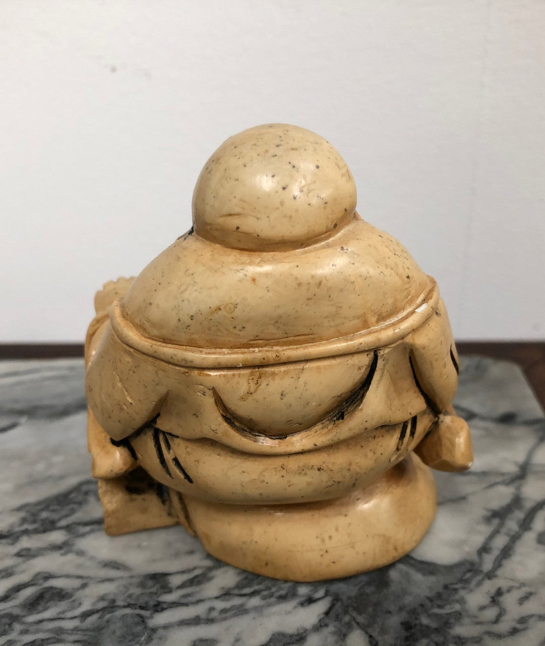 Vintage carved statue of Smiling Buddha