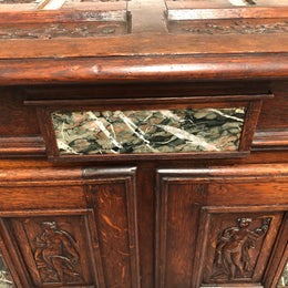 A unique 18th century French oak carved cabinet with inset marble. In good original condition.