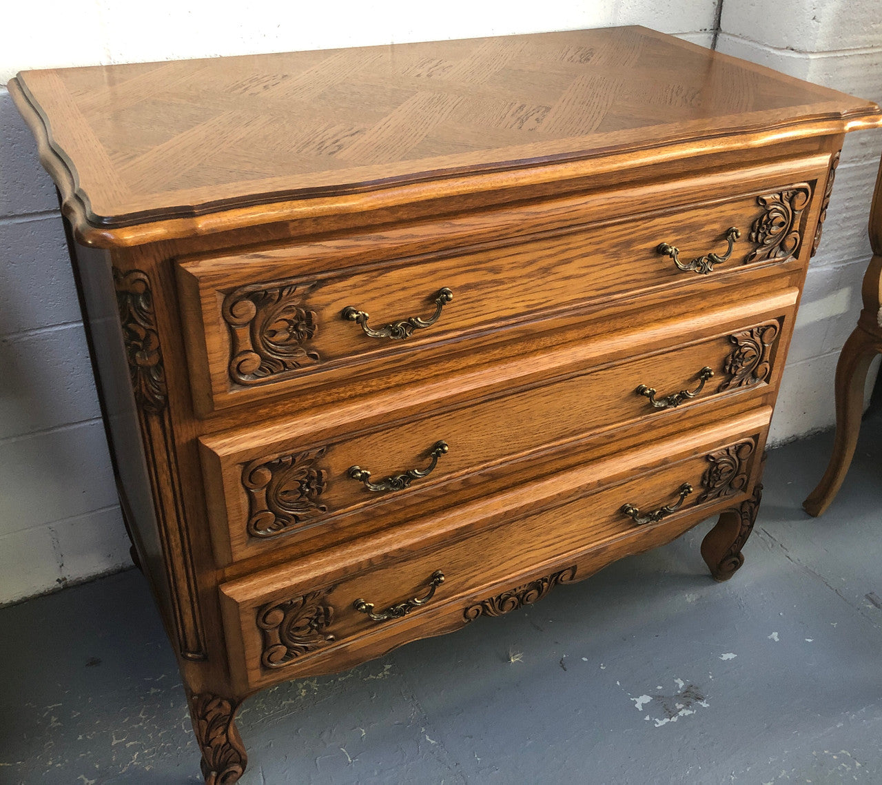 Gorgeous Provincial oak and parquetry top commode. It has beautiful carved Details and in good original detailed condition.