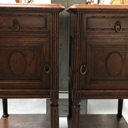 Lovely pair of French Oak Louis XVI style bedside cabinets with inset marble tops a drawer and a cupboard for storage. In good original detailed condition.
