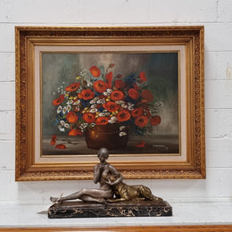 Lovely Vintage signed floral oil on canvas of Poppies and Daisy's and in a decorative gilt frame . In good original detailed condition.