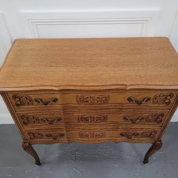 French Oak Louis 15th style nicely carved three drawer wooden top commode. It has been sourced from France and is in good original detailed condition.