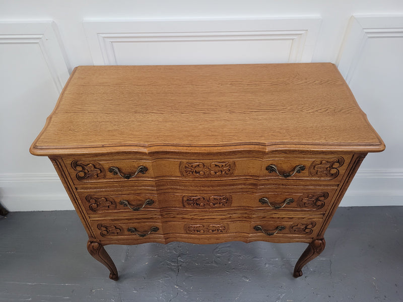 French Oak Louis 15th style nicely carved three drawer wooden top commode. It has been sourced from France and is in good original detailed condition.