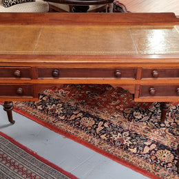 Lovely Victorian Cedar leather tooled  top desk, with five drawers on castors and of pleasing proportions. In very good original detailed condition and has been sourced locally.