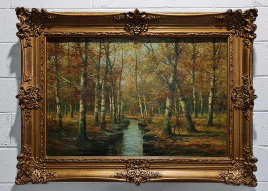 Large French signed oil on canvas painting of Autumn trees on stream scene. In a ornate gilt frame and is in good original condition.