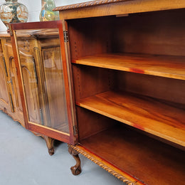 Chippendale style Mahogany two door bookcase. It has bevelled glass doors and two adjustable shelves. It has been sourced locally and is in good original detailed condition.