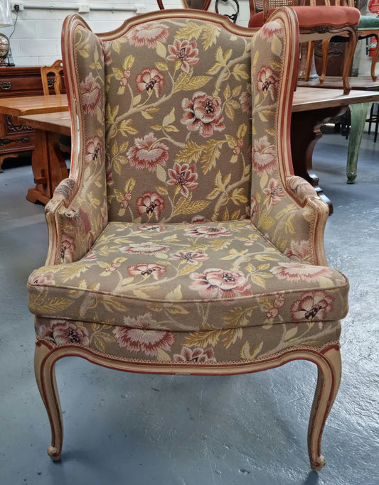 French painted large upholstered arm chair with lovely fabric and very comfortable in good original detailed condition. Some wear to fabric on arm please see photos for full details.