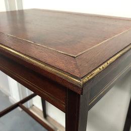 Elegant rectangular mahogany French brass inlaid occasional table. Is in good original condition.