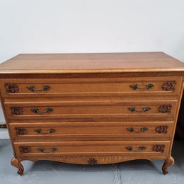Fabulous French light Oak of chest of four drawers with lovely decorative carving. In good original detailed condition.