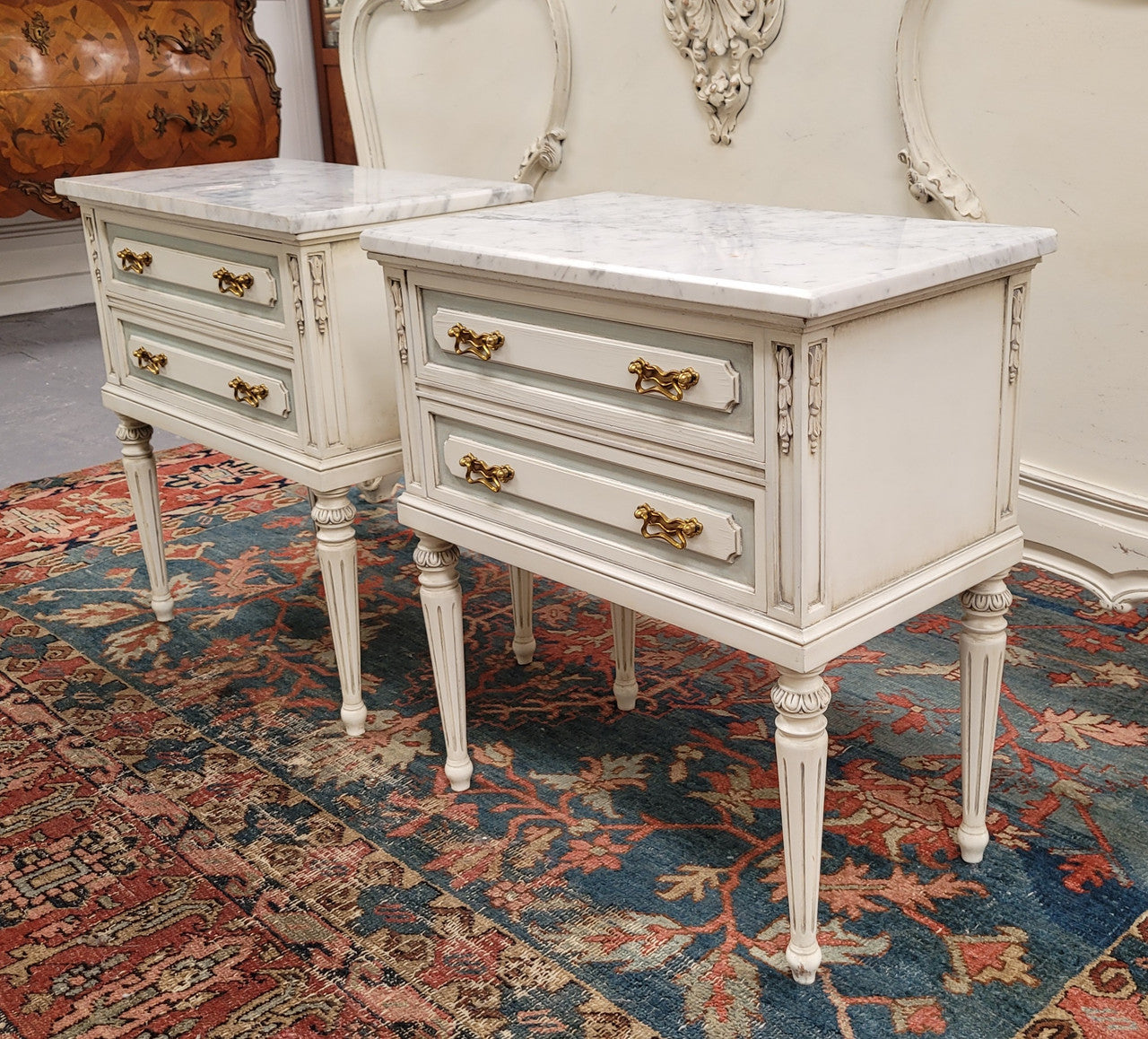 Attractive pair of Vintage French Louis 16th style two drawer marble topped bedsides. They have been sourced from France and are in good original condition.
