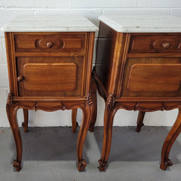 Pair of stunning Louis XV style French Walnut white marble top bedside cabinets. They have one drawer and a cupboard that is marble lined. The marble has been polished and they are in good original detailed condition.