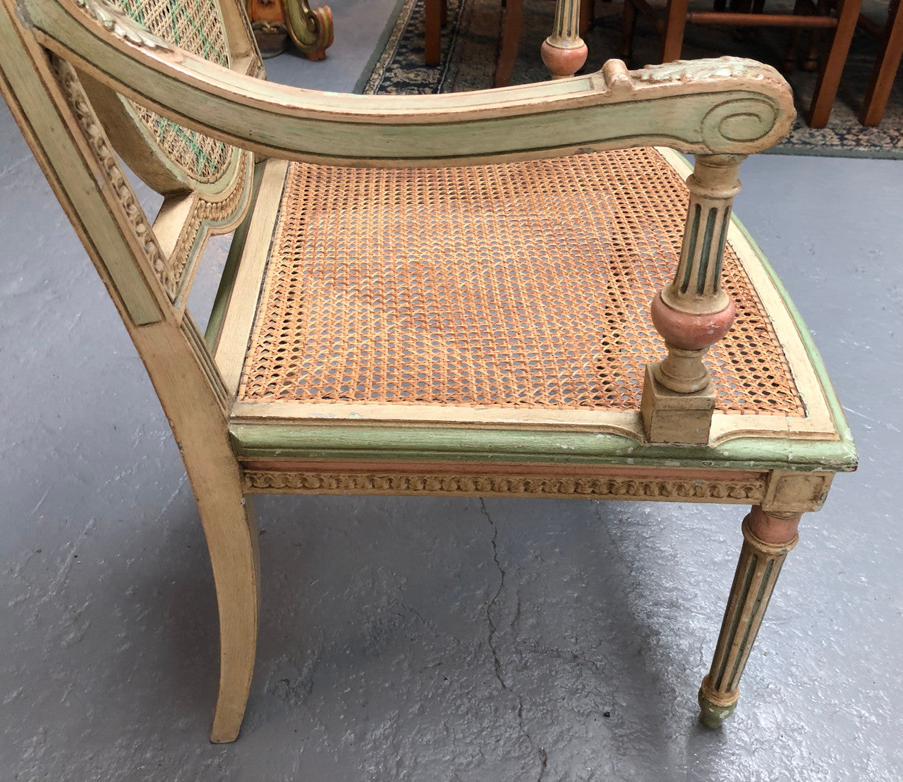 Painted French Louis XVI style cane panel arm chair. Paint is original and it is in very good original condition.