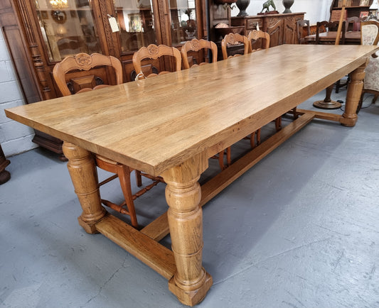 Stunning three meter Bespoke English Oak stretcher base farmhouse dining table. Can easily sit 10-12 people and is in very good original detailed condition.